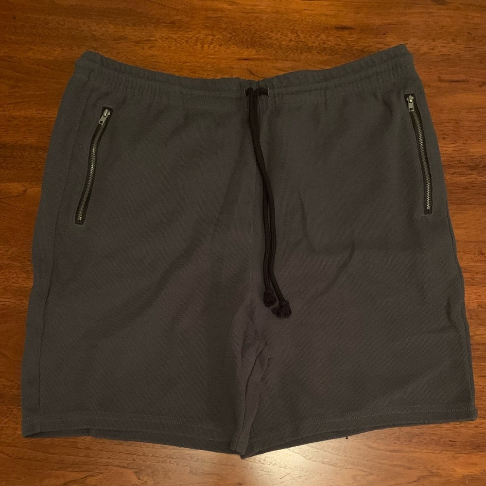 PacSun Men’s gray shorts size larger with zippered pockets.